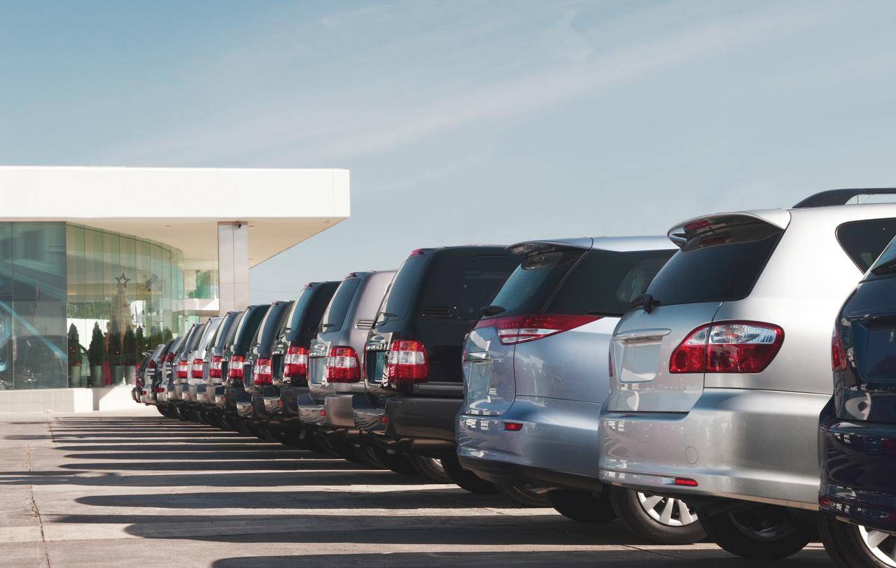 Cars standing in a row at car dealer